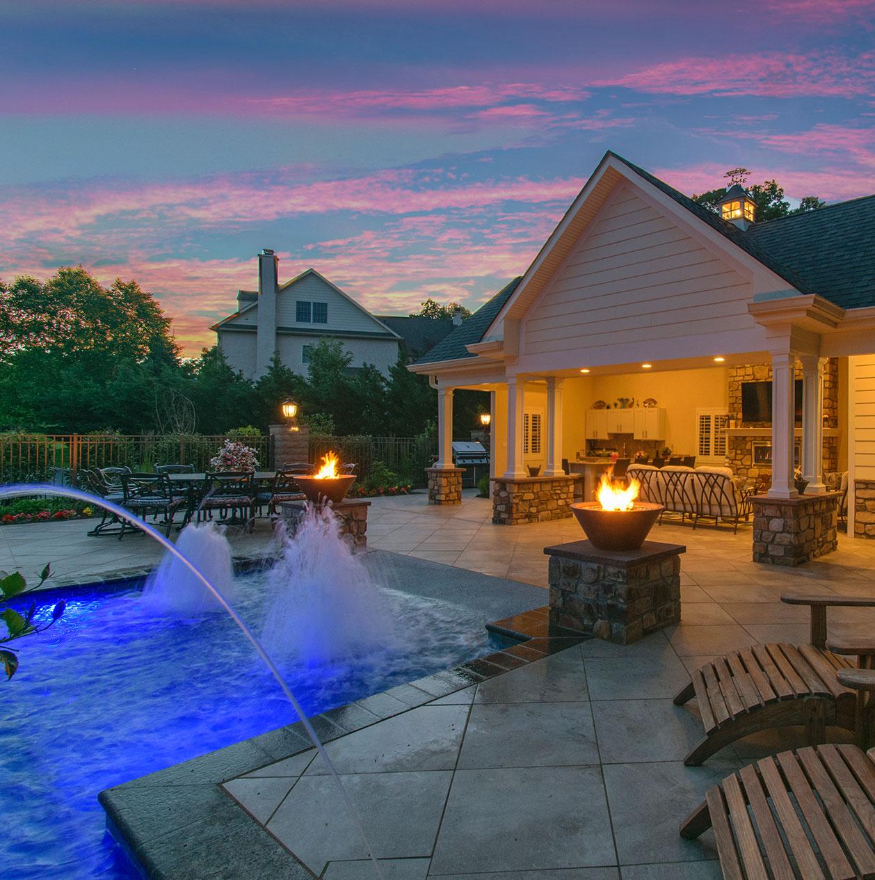 Outdoor space with a custom pool, relaxing patio seating, and scenic views for outdoor living enjoyment