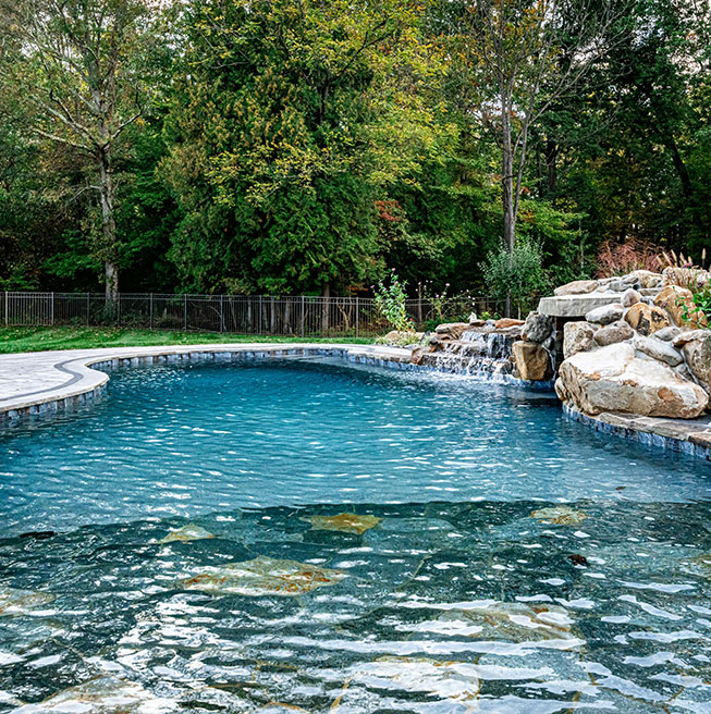 Stunning outdoor living space with a custom pool