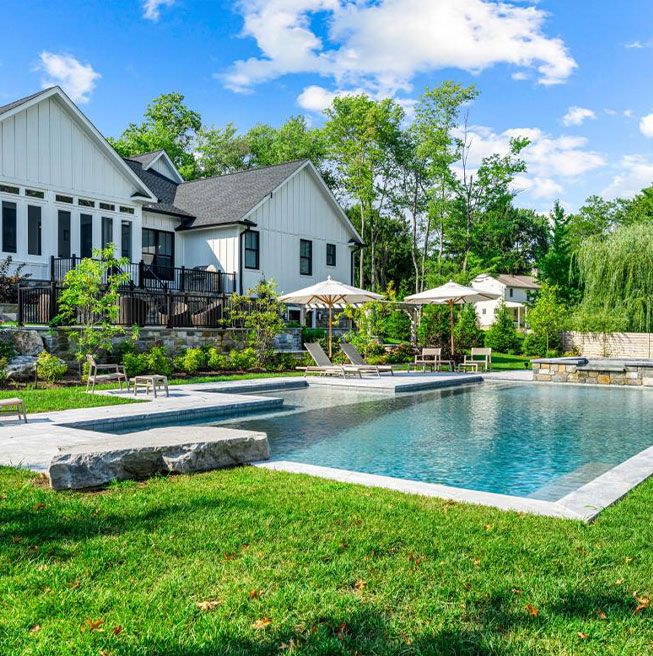 Unwind in a luxurious custom pool setting