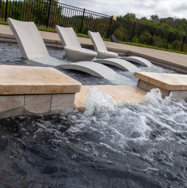 Unwind in a luxurious custom pool setting