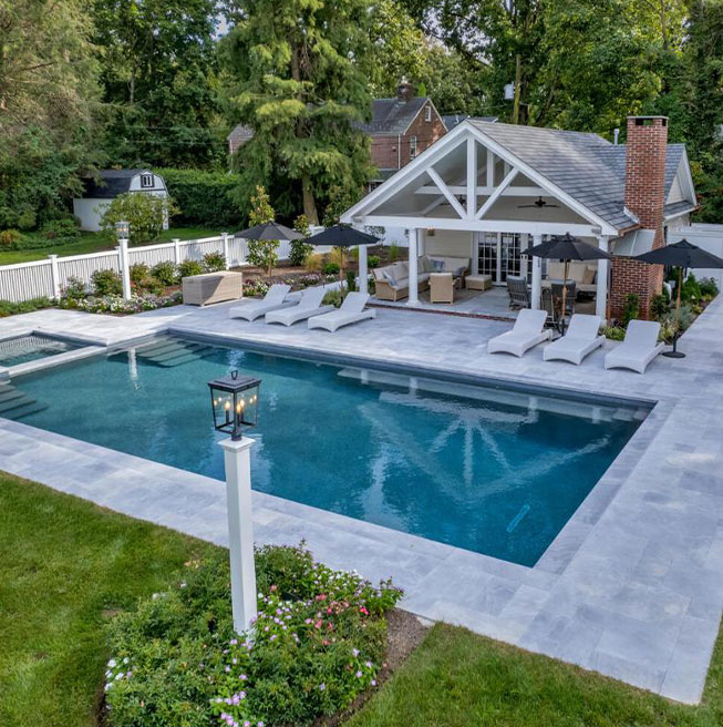 Stunning outdoor living space with a custom pool