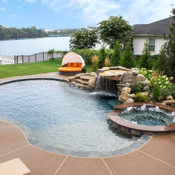 pool with spa, tanning ledge and waterfall grotto