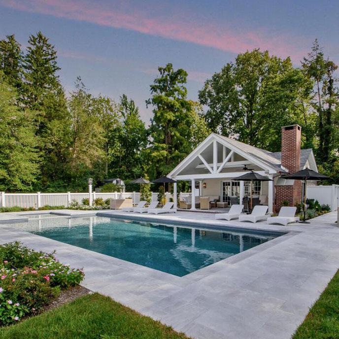 rectangular pool with hot tub