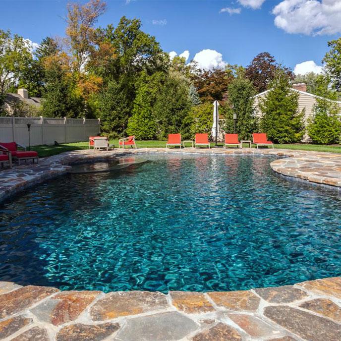 free form pool with stone walkway