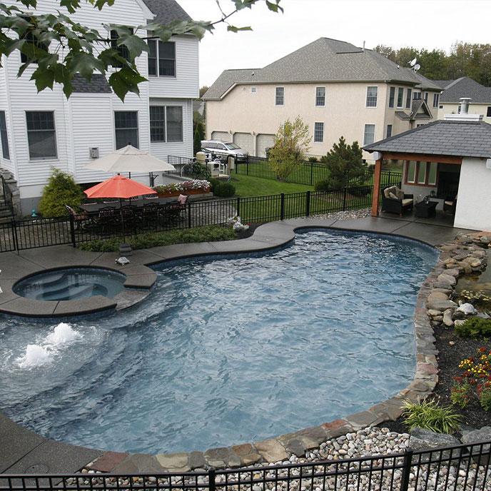 simple pool with spa and waterfall