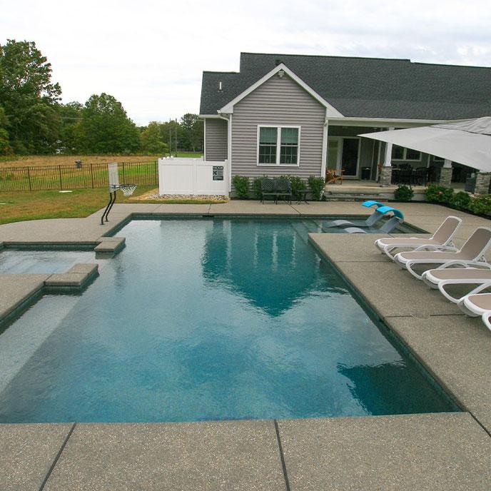 L shaped pool with hot tub