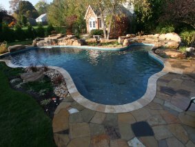 pool with landscaping and hardscaping