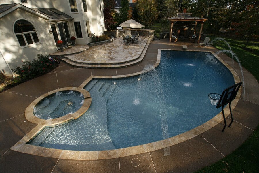 curvilinear pool with spa and diving boards
